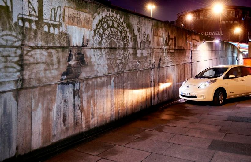 Whie Nissan Leaf parked on pavement